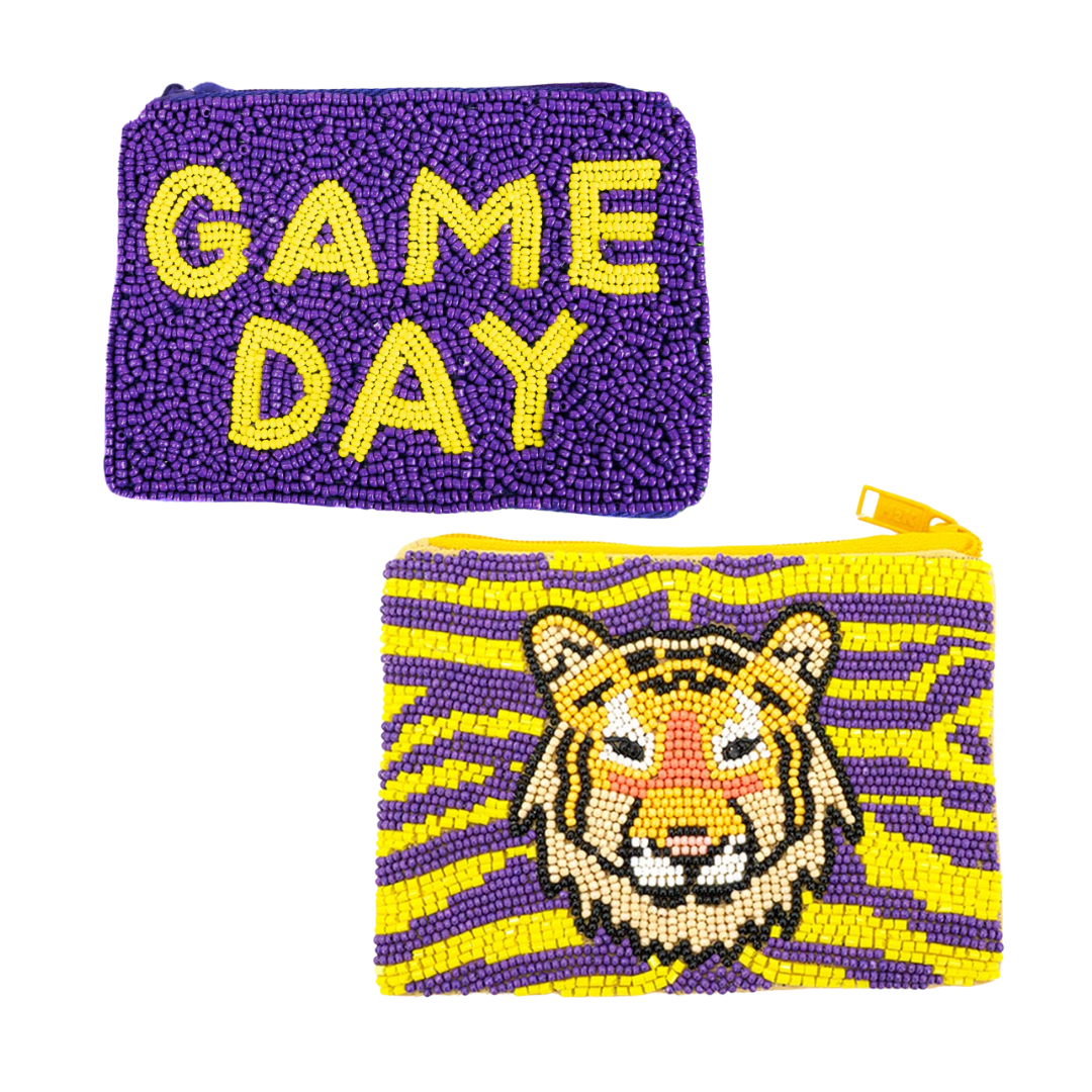 Two coin purses, one with 'GAME DAY' text in yellow on a purple background, and another with a tiger face design in gold and yellow stripes.