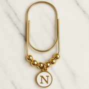 bookmark gold white initial